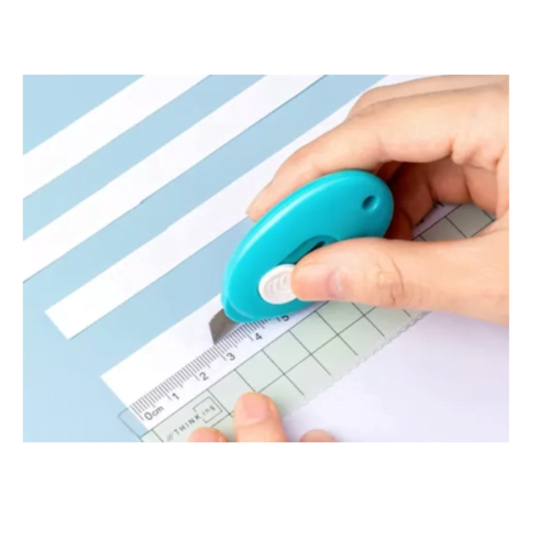 Mini cuchillo retractil